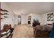 The living room is decorated with a TV, sofa, recliner and brown tile flooring at 11708 Raintree Village Blvd # A, Temple Terrace, FL 33617
