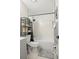 Modern bathroom with a shower-tub combination, sleek fixtures, and organized shelving at 13250 Ridge Rd # 4B3, Largo, FL 33778