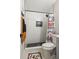 Modern bathroom features stylish hexagon tile, shower niche, and glass partition at 13250 Ridge Rd # 4B3, Largo, FL 33778