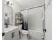 Stylish bathroom featuring modern fixtures, a sleek vanity, and a shower-tub combination at 13250 Ridge Rd # 4B3, Largo, FL 33778