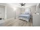 Bright bedroom featuring modern decor, a ceiling fan, and soft, comforting colors at 13250 Ridge Rd # 4B3, Largo, FL 33778