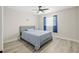 Cozy bedroom with a comfortable bed, modern ceiling fan, and soothing blue accents at 13250 Ridge Rd # 4B3, Largo, FL 33778