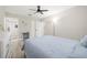 Spacious bedroom featuring neutral tones, a ceiling fan, and modern furnishings at 13250 Ridge Rd # 4B3, Largo, FL 33778