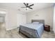 Comfortable bedroom featuring a ceiling fan, closet, and soothing decorations at 13250 Ridge Rd # 4B3, Largo, FL 33778