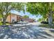 Apartment building exterior view shows parking and mature trees at 13250 Ridge Rd # 4B3, Largo, FL 33778