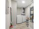 Bright laundry room with modern appliances and updated flooring at 13250 Ridge Rd # 4B3, Largo, FL 33778