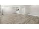 Open-concept living room boasts wood-look floors and lots of natural light at 13250 Ridge Rd # 4B3, Largo, FL 33778