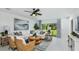 Elegant living room with stylish decor, comfortable seating, and ample natural light at 13253 Tropical Breeze Way, Hudson, FL 34669