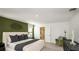 The main bedroom features an accent wall and ensuite bathroom at 13279 Tropical Breeze Way, Hudson, FL 34669