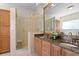 Elegant bathroom with granite countertops and glass shower at 13548 Lake Magdalene Dr, Tampa, FL 33613