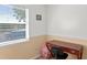 Bedroom with a small desk and a large sunny window overlooking the yard at 13548 Lake Magdalene Dr, Tampa, FL 33613
