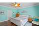 Comfortable bedroom with hardwood floors and a ceiling fan at 13548 Lake Magdalene Dr, Tampa, FL 33613