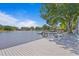 The house has an outdoor deck overlooking the lake, perfect for entertaining guests at 13548 Lake Magdalene Dr, Tampa, FL 33613