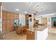 Large kitchen with stainless steel appliances, an island, and ample storage at 13548 Lake Magdalene Dr, Tampa, FL 33613