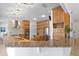 Spacious kitchen with granite counters, stainless steel appliances, and wooden cabinets at 13548 Lake Magdalene Dr, Tampa, FL 33613