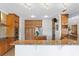 Kitchen featuring granite countertops, stainless steel appliances, and wooden cabinets at 13548 Lake Magdalene Dr, Tampa, FL 33613