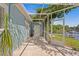 The exterior has a covered patio with ample space for seating and views of the lake at 13548 Lake Magdalene Dr, Tampa, FL 33613