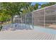 The exterior has a seating area overlooking a pool and peaceful lake view at 13548 Lake Magdalene Dr, Tampa, FL 33613
