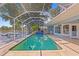 Relax in this large screened in pool with views of the canal at 13548 Lake Magdalene Dr, Tampa, FL 33613