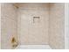 Shower with gold shower head and tile at 13548 Lake Magdalene Dr, Tampa, FL 33613