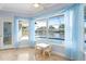 Bright sunroom with views of pool and lake at 13548 Lake Magdalene Dr, Tampa, FL 33613