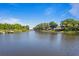 Beautiful waterfront view, showcasing serene waters and lush green surroundings at 13548 Lake Magdalene Dr, Tampa, FL 33613