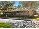 Low angle exterior shot of a single story community clubhouse in a park-like setting at 13608 S Village Dr # 6203, Tampa, FL 33618