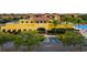 Exterior shot of the community center entrance showcasing landscaping and a blue handicapped parking space at 13608 S Village Dr # 6203, Tampa, FL 33618