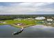 Aerial view of a park featuring a lake, playground, walking path, and other community amenities at 13608 S Village Dr # 6203, Tampa, FL 33618