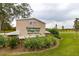 Exterior view of Carrollwood Village Park sign with landscaped surroundings and a clear blue sky at 13608 S Village Dr # 6203, Tampa, FL 33618