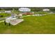 Aerial view of the park's pavilion with picnic tables, manicured lawn, and walking paths, surrounded by mature trees at 13608 S Village Dr # 6203, Tampa, FL 33618