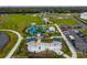Overhead view of the splash pad, playground, and parking lot, with picnic tables and seating areas at 13608 S Village Dr # 6203, Tampa, FL 33618