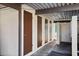 Image of outdoor storage units with brown doors under a covered walkway at the property at 13608 S Village Dr # 6203, Tampa, FL 33618