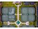 Top-down aerial view of tennis courts highlighting their layout and surrounding landscape within the community at 13608 S Village Dr # 6203, Tampa, FL 33618