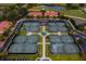 Aerial view of tennis courts with lush landscaping and well-maintained facilities in a community setting at 13608 S Village Dr # 6203, Tampa, FL 33618