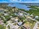 Breathtaking aerial shot showcasing the home's proximity to the water, pond and lush surroundings at 13974 75Th Ave, Seminole, FL 33776