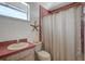 Pink bathroom with a seashell and starfish theme, plus a shower and bathtub at 13974 75Th Ave, Seminole, FL 33776