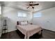 Inviting bedroom with a vaulted ceiling, hardwood floors, and natural light at 13974 75Th Ave, Seminole, FL 33776
