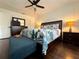 Bright bedroom with hardwood floors, dresser, tropical bedding, and bedside tables at 13974 75Th Ave, Seminole, FL 33776