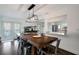 Spacious dining room with hardwood floors and view of kitchen and living areas at 13974 75Th Ave, Seminole, FL 33776