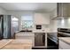 Updated kitchen with stainless steel appliances, granite counters and modern cabinets at 13974 75Th Ave, Seminole, FL 33776