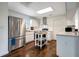 Bright kitchen featuring stainless steel appliances, white cabinets, and ample counter space at 13974 75Th Ave, Seminole, FL 33776