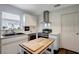 Updated kitchen with stainless steel appliances, granite counters and modern cabinets at 13974 75Th Ave, Seminole, FL 33776