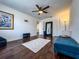 Spacious living room boasts hardwood floors, neutral walls, modern lighting, and a full-length mirror at 13974 75Th Ave, Seminole, FL 33776