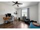 Bright office space with hardwood floors, a comfortable desk area, and a relaxing seating nook for a productive atmosphere at 13974 75Th Ave, Seminole, FL 33776