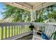 Charming outdoor porch features comfortable seating and picturesque views at 13974 75Th Ave, Seminole, FL 33776