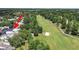 An aerial view showcases the property next to the golf course, offering a serene view at 14205 Cypress Ter, Tampa, FL 33618