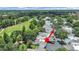 Overhead view showcases golf course community and neighboring townhomes, highlighting the property's peaceful location at 14205 Cypress Ter, Tampa, FL 33618