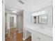 Bathroom with a vanity, sink, mirror and access to toilet room at 14205 Cypress Ter, Tampa, FL 33618
