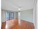 Large bedroom with sliding glass door to the lanai and wood look floors at 14205 Cypress Ter, Tampa, FL 33618